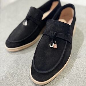 - Black suede loafers